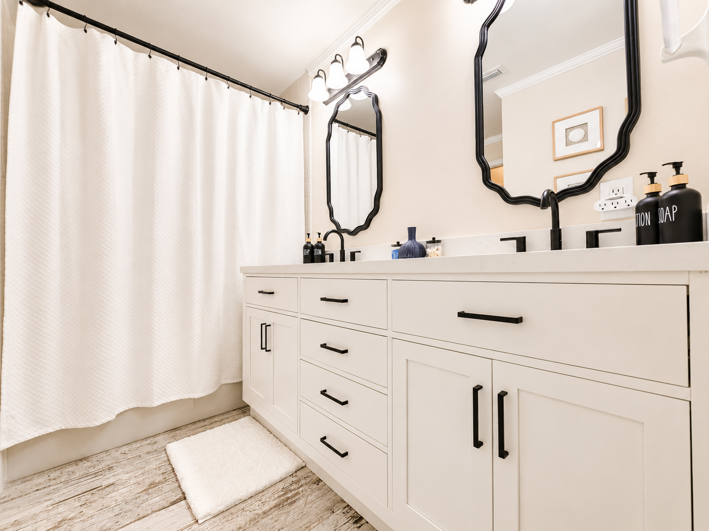 Guest bathroom with double vanity and black fixtures