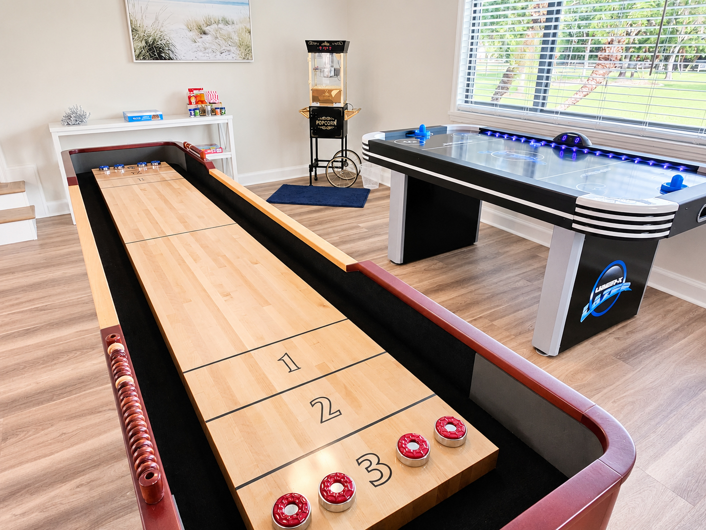 Game room with shuffleboard, air hockey and popcorn machine